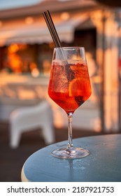 Glass Of Orange Fresh Spritz Drink Cocktail On A Beach Bar. Food And Drink Concept