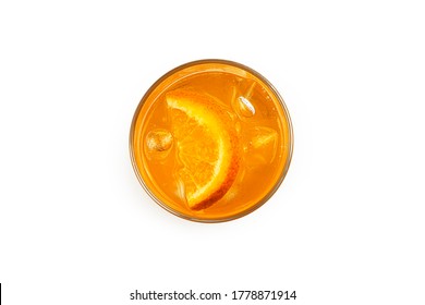 Glass with orange lemonade and ice on a white background. The view from the top. High quality photo