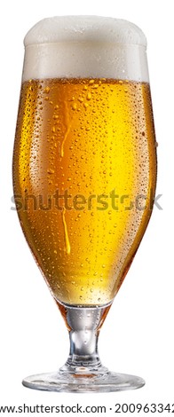 Glass of pale lager beer with water drops on cold glass surface isolated on white background. File contains clipping path.