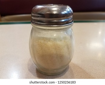 A Glass Parmesan Cheese Shaker For Pizza