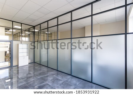 Glass partition. Glass wall in the office space.