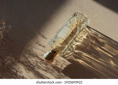 Glass Perfume Bottle With Botanical Shadows And Sunlight. Unisex Perfume Concept