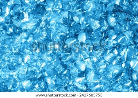 Glass pieces texture. Broken glass pattern. Shattered crystal glass frame. Decorative blue wall. Artistic effect background. Special decoration effect. Blue crystal texture.