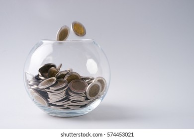 Glass Piggy Box And Gold Coins, Saving Money For Future Investment Concept Isolated On White With Copy Space.