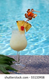 Glass Of Pina Colada Cocktail On Swimming Pool Side