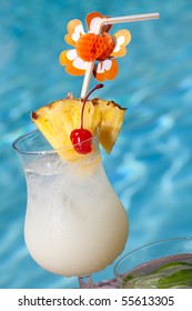 Glass Of Pina Colada Cocktail On Swimming Pool Side