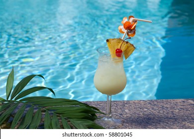 Glass Of Pina Colada Cocktail On Swimming Pool Side