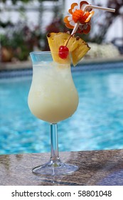 Glass Of Pina Colada Cocktail On Swimming Pool Side