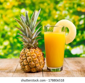 Glass Of Pineapple Juice With Fresh Fruits