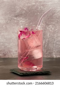 A Glass Of Pink Gin And Rose Lemonade On A Light Pink Background, Top Copy Space