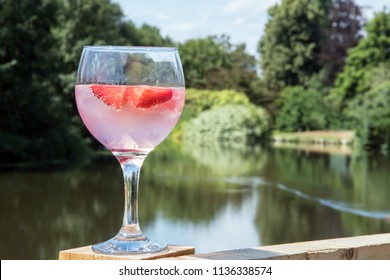 Glass Of Pink Gin And Strawberries