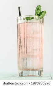 Glass Of Pink Gin And Tonic Cocktail