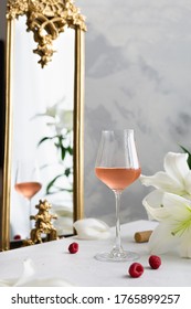 Glass Of Pink Rose Wine, Cork, Raspberries And A Bouquet Of White Lilies On Table And Vintage Mirror On Background. Valentines Day, Wedding Party Celebration, Birthday. Wine Map, Bar Menu. Copy Space