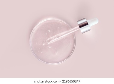 Glass Pipette Serum Gel In Petri Dish On A Beige Background