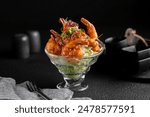 A glass plate with dynamite shrimp on a dark background