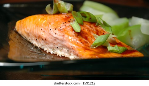 Glass Plate With A Steelhead Trout Fillet And Steamed Summer Squash