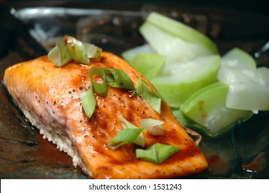 Glass Plate With A Steelhead Trout Fillet And Steamed Summer Squash