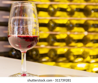 Glass Of Port Ruby Wine With Bottles In Background