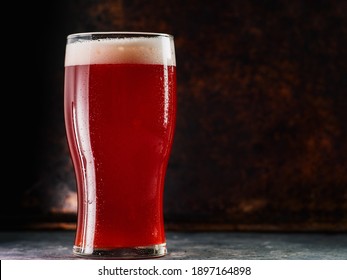 A Glass Of Red Ale Beer, Rusty Iron Background Copy Space