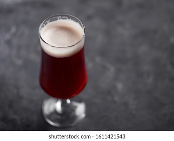 A Glass Of Red Ale On A Dark Background