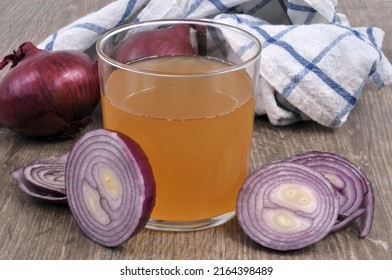 Glass Of Red Onion Juice And Its Ingredients Close-up