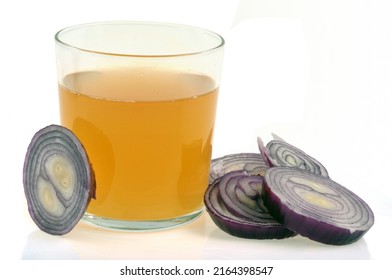 Glass Of Red Onion Juice And Its Ingredients On White Background