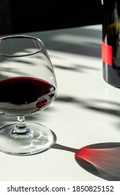 Glass Of Red Ruby Port Wine On White Table