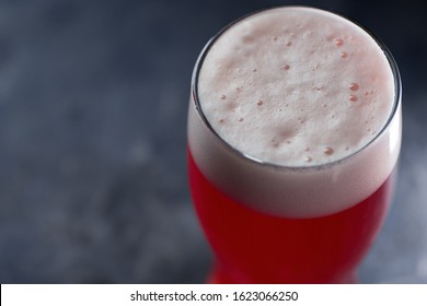 A Glass Of Red Sour Craft Beer Or Ale On A Concrete Grey Table Copy Space