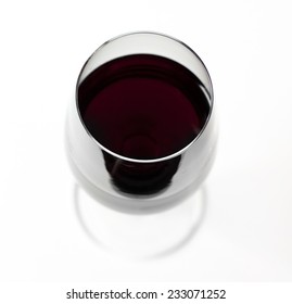 A Glass Of Red Wine From Above On White Background