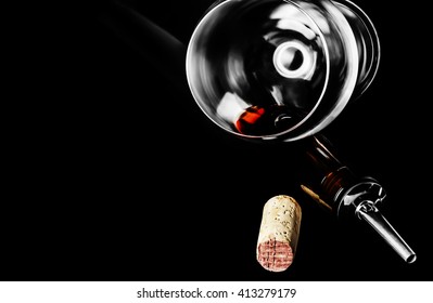 A Glass Of Red Wine, A Bottle, Cork, Corkscrew And A Tube With Dispenser On Black Background