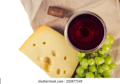 Glass Of Red Wine , Cheese And Grapes Top View