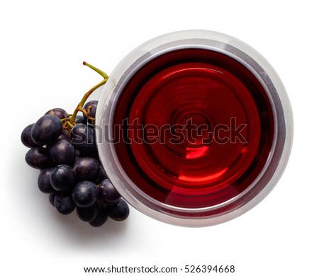 Glass of red wine and grapes isolated on white background from top view