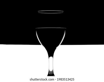 Glass Of Red Wine On Abstract Black And White Background