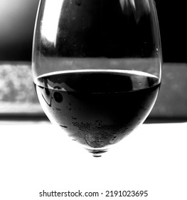 Glass Of Red Wine On Abstract Black And White Background