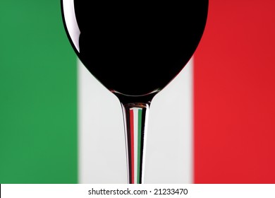 A Glass Of Red Wine On An Italian Flag Background.