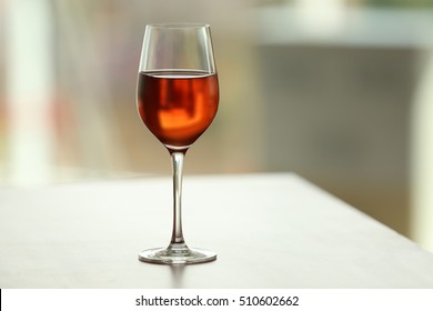 Glass With Red Wine On Table