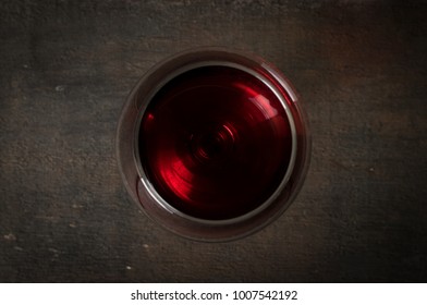 Glass Of Red Wine On Wooden Table. View From Top