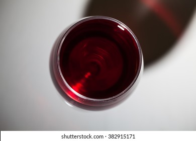 Glass Of Red Wine On Wooden Table. Top View