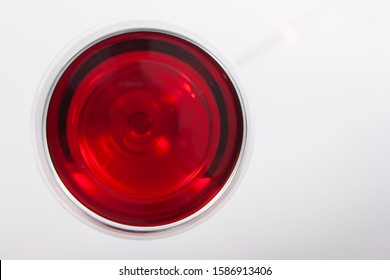 Glass Of Red Wine With Shadow.Top View . Close-up