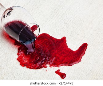 A glass of red wine was spilled on a carpet. Damage insurance.