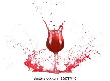 Glass with red wine, red wine splash, wine pouring on table isolated on white background, big splash around 