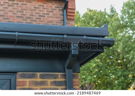 Glass reinforced polyester roof with anthracite soffits, fascias and guttering. Close up detailed view.