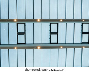 Glass roof with windows and a few lights. - Shutterstock ID 1321123934