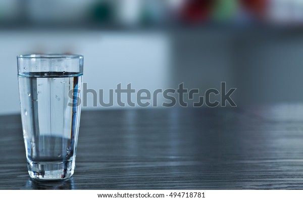 Glass Room Temperature Water On Black Royalty Free Stock Image