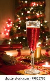 A Glass Of Rose Champagne On A Decorated Christmas Day Dinner Table