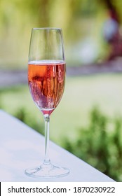 Glass Of Rose Sparkling Wine Outdoor. Celebrating, Relax, Travel Concept