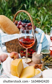 Glass Of Rose Wine On A Picnic In Provence Style. Close-up