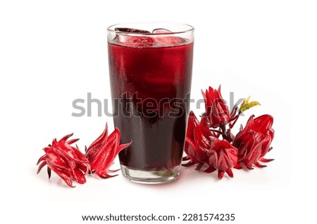Glass of roselle juice ( Jamaica sorrel ) with roselle fruits isolated on white background.