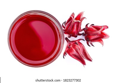 Glass of roselle juice tea and fresh Roselle flower ( Jamaica sorrel, Rozelle or hibiscus sabdariffa ) isolated on white background. Top view. Flatlay.
