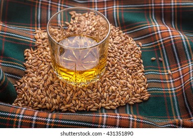 Glass Of Scotch Whisky On A Tartan